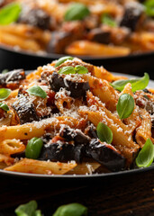 Pasta alla Norma with eggplant or aubergine, tomato, parmesan and basil. Healthy food