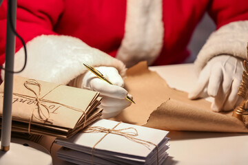 Santa Claus writing letter on Christmas eve
