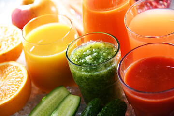 Glasses with fresh organic vegetable and fruit juices