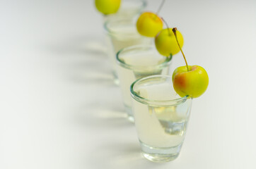 Delicious Calvados served in shot glasses decorated with crab apples