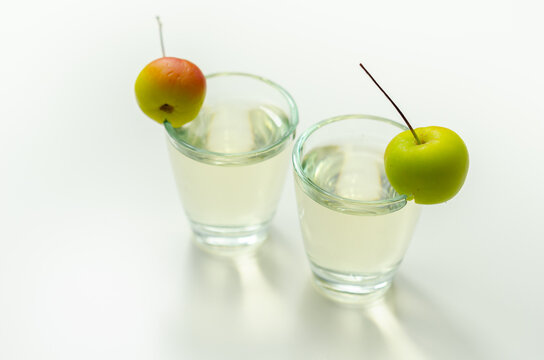 Delicious Calvados served in shot glasses decorated with crab apples