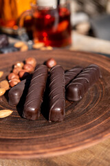 Chocolate on the brown plate. Copy space. Close up.Sunshine outside. 