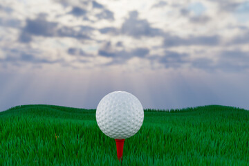 Golf ball on a tee on the golf course over a  green field at the sunset. 
