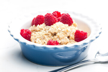 still life of porridge with raspberries