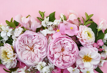Delicate blooming festive pink roses and dahlias background, blossoming rose flowers soft pastel frame, bouquet floral card