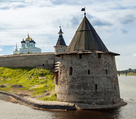 Stone tower and Pskov Kremlin fortress wall at the confluence of two rivers, Russia