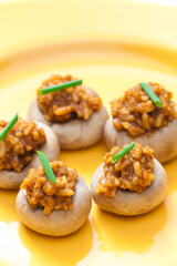 mushrooms stuffed with red paprika spiced rice and onion
