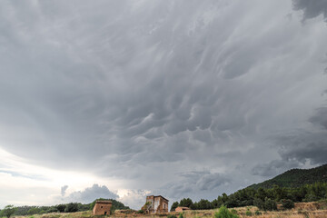 Fototapeta premium Abandoned old house in ruins with stormy sky