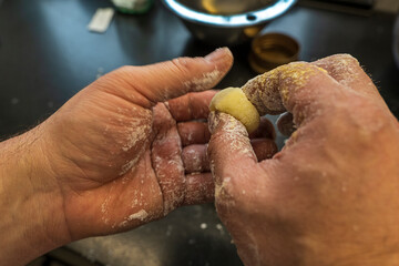 Pasta, Polish dumplings "kopytka", preparation of dishes, hand-made, flour and egg dough, cooking, visible male hands