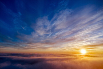 Fototapeta na wymiar the golden light above the clouds at sunrise