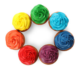 Different delicious colorful cupcakes on white background, top view