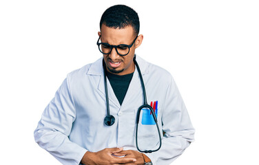 Fototapeta premium Young african american man wearing doctor uniform and stethoscope with hand on stomach because indigestion, painful illness feeling unwell. ache concept.