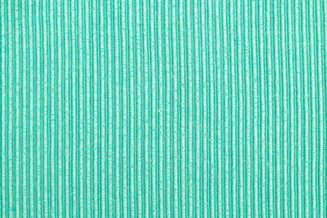 green fabric with straight lines pattern used for background