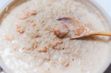 Cooking shrimp risotto in creamy sauce