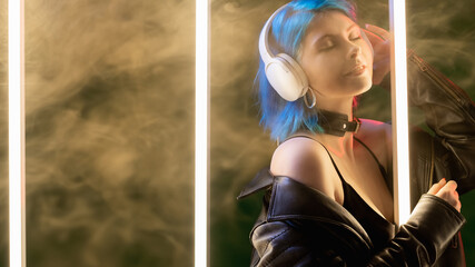 Nightclub music. Cyber gadget. Modern technology. Satisfied futuristic woman in headset listening...
