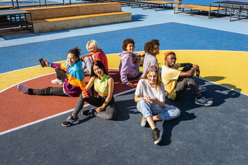 Multiracial group of young friends bonding outdoors