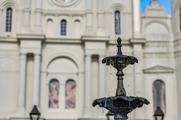 Fototapeta na wymiar Shallow focus on the top of the fountain in front of the famous St. Louis Cathedral in Jackson Square, in the French Quarter.