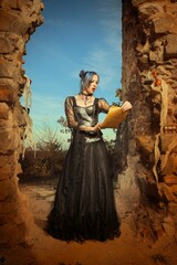 Mysterious woman sorcerer ready to fight in ruins by sword and spell