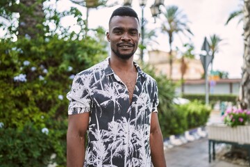 Young african american man smiling confident at park