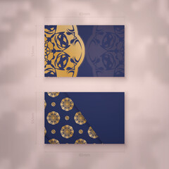 Presentable business card in dark blue color with mandala gold pattern for your business.