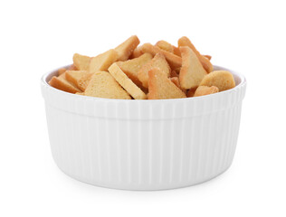 Delicious crispy rusks in bowl on white background