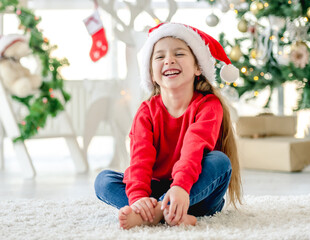 Child girl in Christmas time