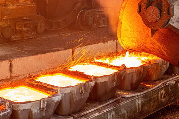 Copper ore processing. Pouring hot metal at the factory. Foundry.