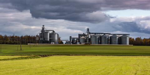 modern granary elevator and seed cleaning line in silver silos on agro-processing and manufacturing...