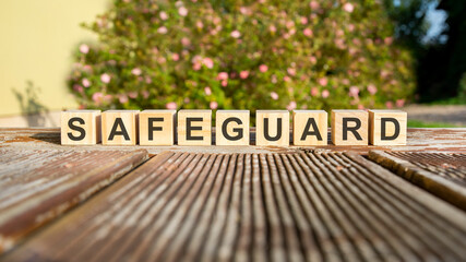 the word safeguard written on the cubes in black letters
