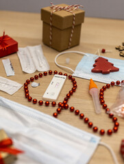 christmas decoration and covid test with mask on table