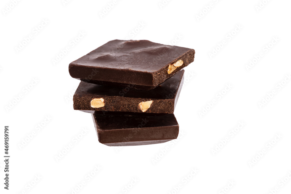 Poster three pieces of chocolate with nuts lie side by side isolated on white background