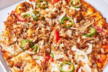  Delicious kebab italian pizza on a cardboard surface