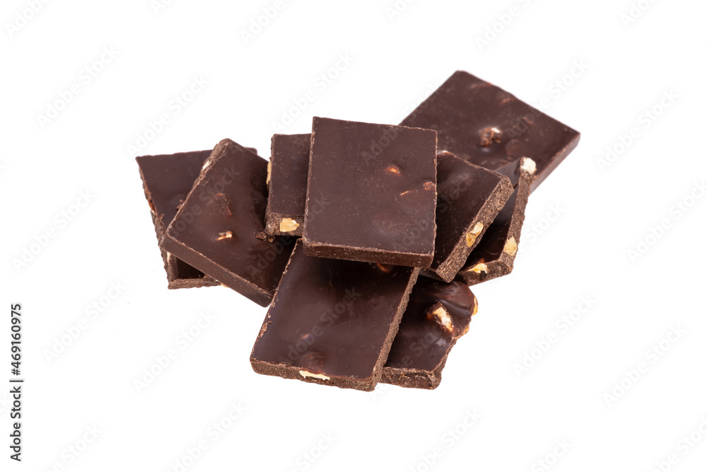Aufkleber dark chocolate with nuts in a heap isolated on white background