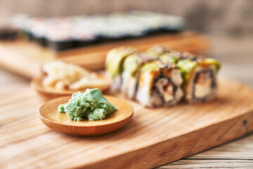 Wooden board of shrimp and cheese cream uramaki sushi on a wooden surface © Krakenimages.com