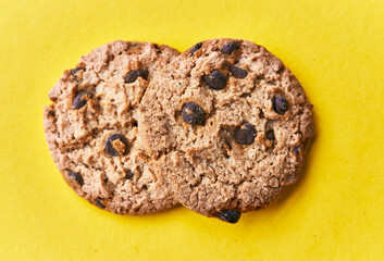  Delicious chocolate cookies on a yellow background