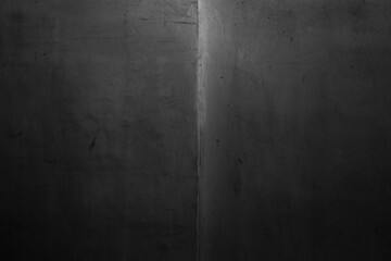 Old black concrete wall texture. Grunge background