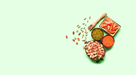 Organic ingredients for Flexitarianism or Flexible Vegetarianism on green background. Creative copy space.