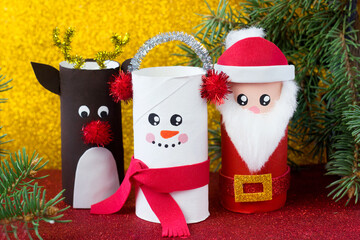 Handmade craft project from toilet tube. Creative kids DIY New year. Cute Snowman, Deer, Santa Claus for Christmas party