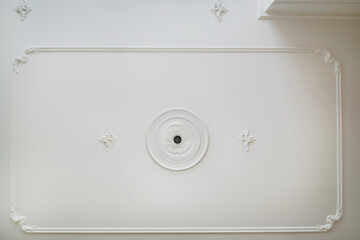 Detail of corner ceiling cornice with intricate crown molding.