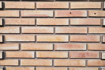 Brick wall texture with cracked tiles and cement. Classic brickwall surface background