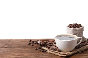 Washable wall murals Cafe Cup of aromatic hot coffee and beans on wooden table against white background. Space for text