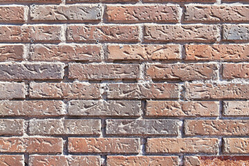 Brick wall texture with cracked tiles and cement. Classic brickwall surface background
