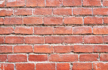 Brick wall texture with cracked tiles and cement. Classic brickwall surface background