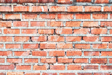 Brick wall texture with cracked tiles and cement. Classic brickwall surface background