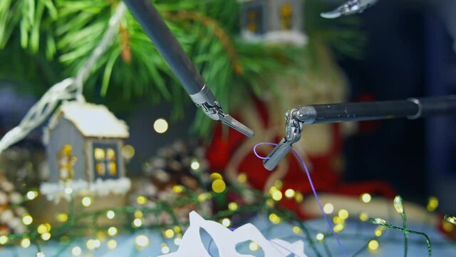 Smart cyber machine preparing decorations for Christmas tree. Robotic industry on New year background. Future innovations.