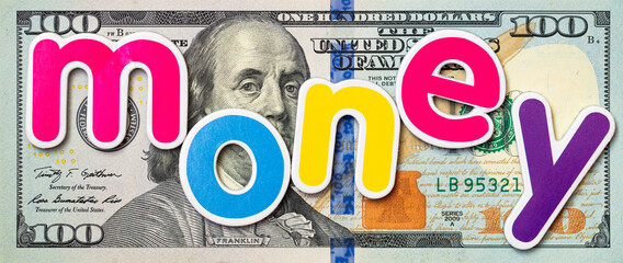 money colorful inscription on US 100 dollar