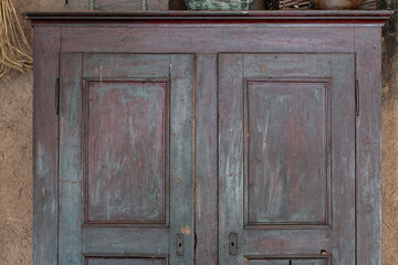Very old, grunge and aged purple wooden rural closet background with copy space. HDR image
