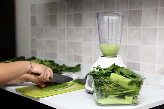 Preparation Of Green Juice In The Kitchen With Blender Nopales Are Cut On Chopping Board As An Ingredient In A Nutritious And Healthy Dish
