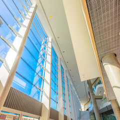 Fototapeta premium Abstract fragment of architecture of modern lobby, hallway of the luxury hotel, shopping mall, business center in Vancouver, Canada. Interior design.