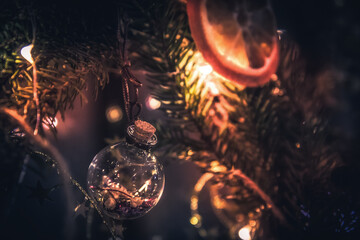Blurred dark Christmas vintage background with decorated Christmas wreath with Christmas ball and...